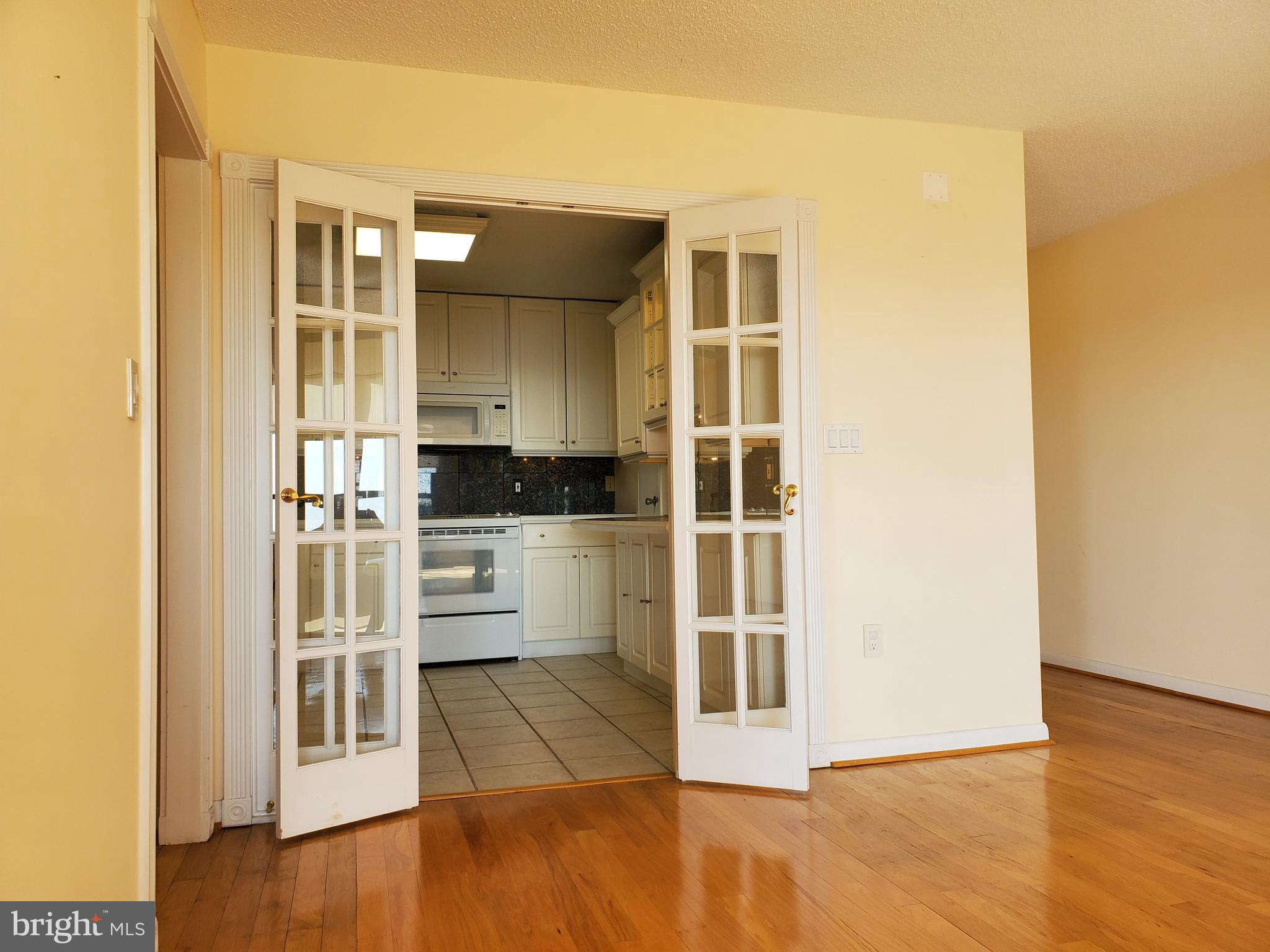 205 East Joppa Road, Unit 2105 Towson, MD 21286 - Photo 14 of 46 Remodeled kitchen with French Doors