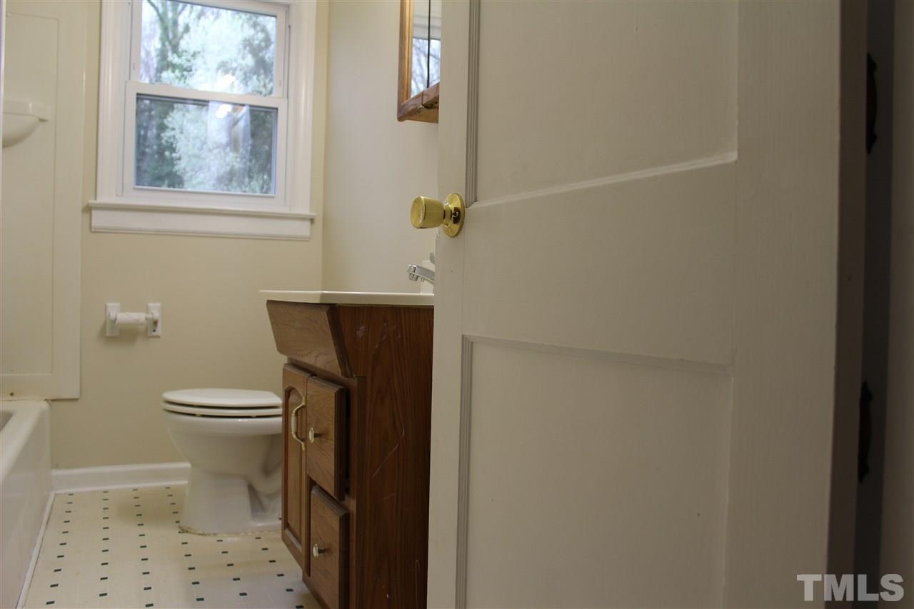 500 Grovemont Road Raleigh, NC 27603 - Photo 11 of 18 a bathroom with a toilet and a shower