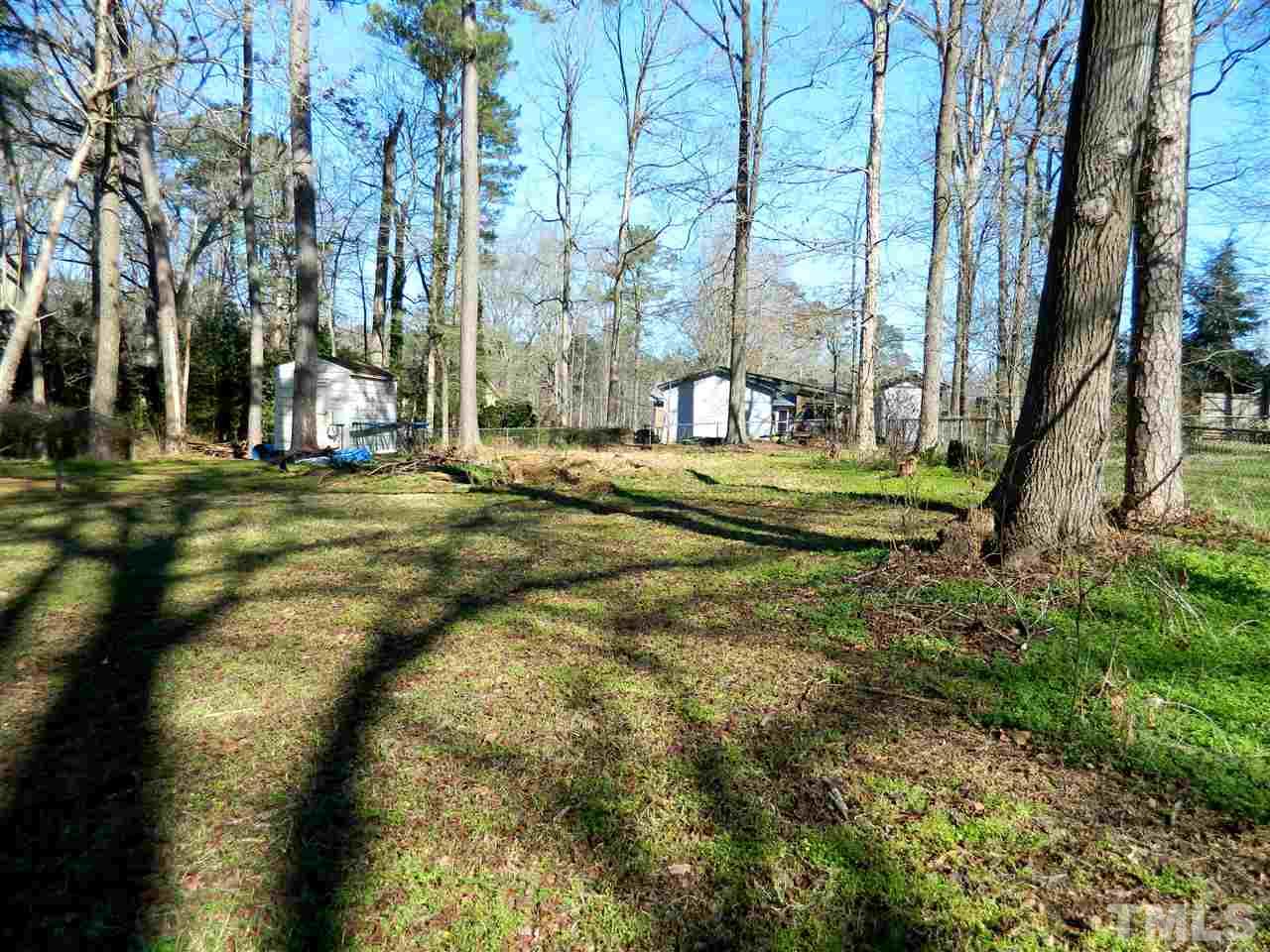 500 Grovemont Road Raleigh, NC 27603 - Photo 15 of 18 a view of a playground with a tree
