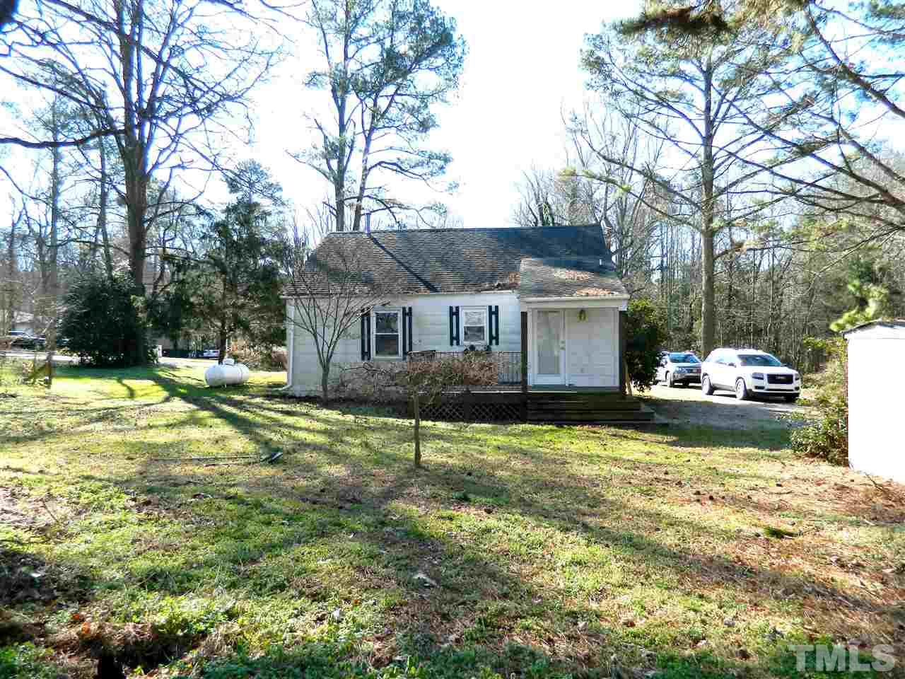 500 Grovemont Road Raleigh, NC 27603 - Photo 16 of 18 a view of a house with a yard and sitting area