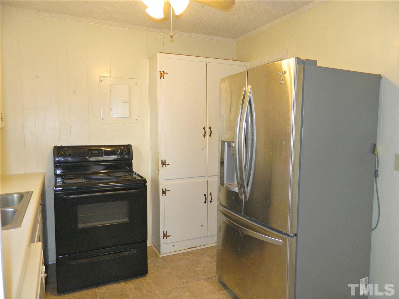 500 Grovemont Road Raleigh, NC 27603 - Photo 7 of 18 a view of a kitchen with refrigerator and stove