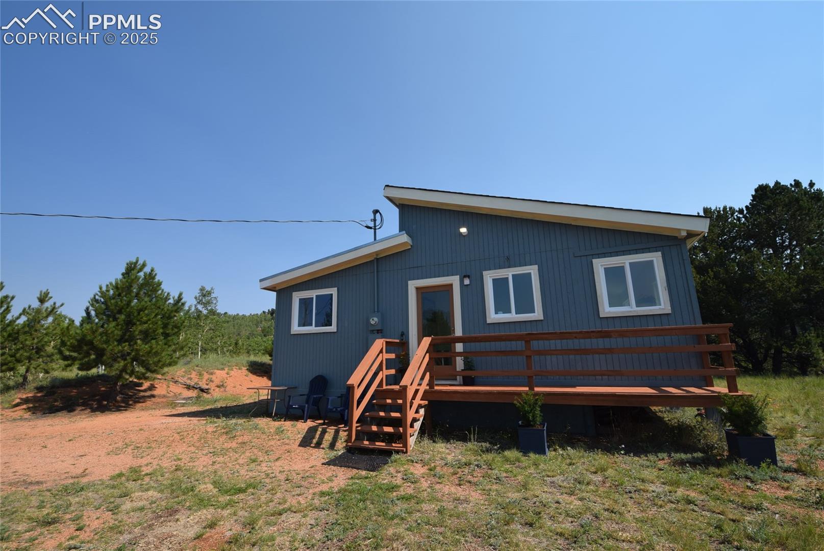 80 Spur Road Divide, CO 80814 - Photo 1 of 48 Back of house with a deck