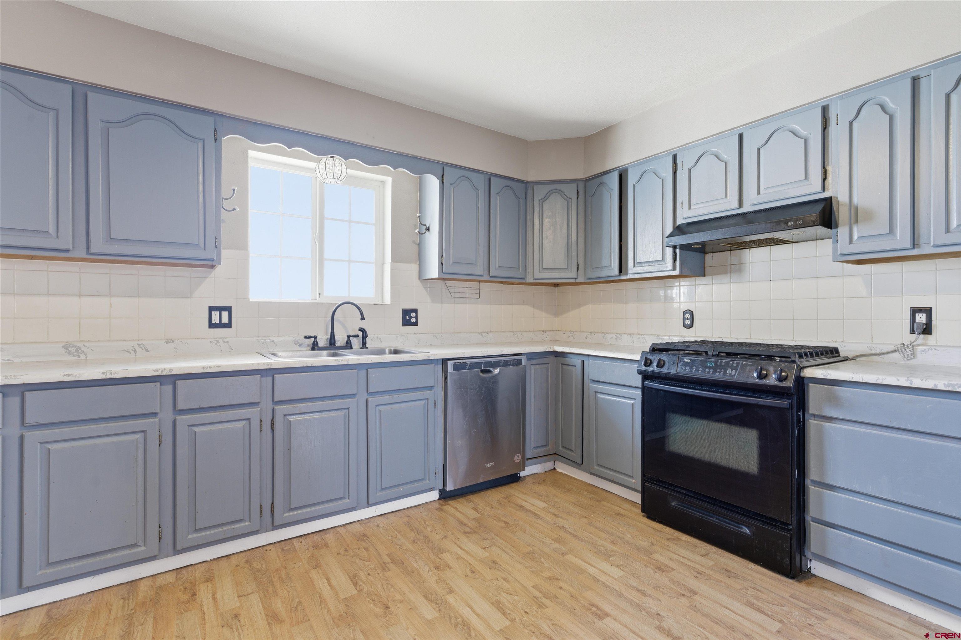 16216 2600th Road Cedaredge, CO 81413 - Photo 5 of 45 a kitchen with stainless steel appliances granite countertop a stove and a sink