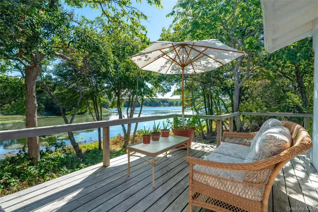 a view of a chairs and table in the balcony