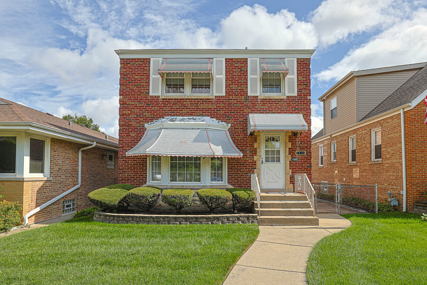5245 North Rutherford Avenue Chicago, IL 60656 - Photo 1 of 21 a front view of a house with a yard