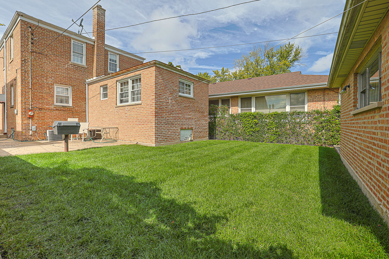 5245 North Rutherford Avenue Chicago, IL 60656 - Photo 20 of 21 a view of a house with a chairs in a patio