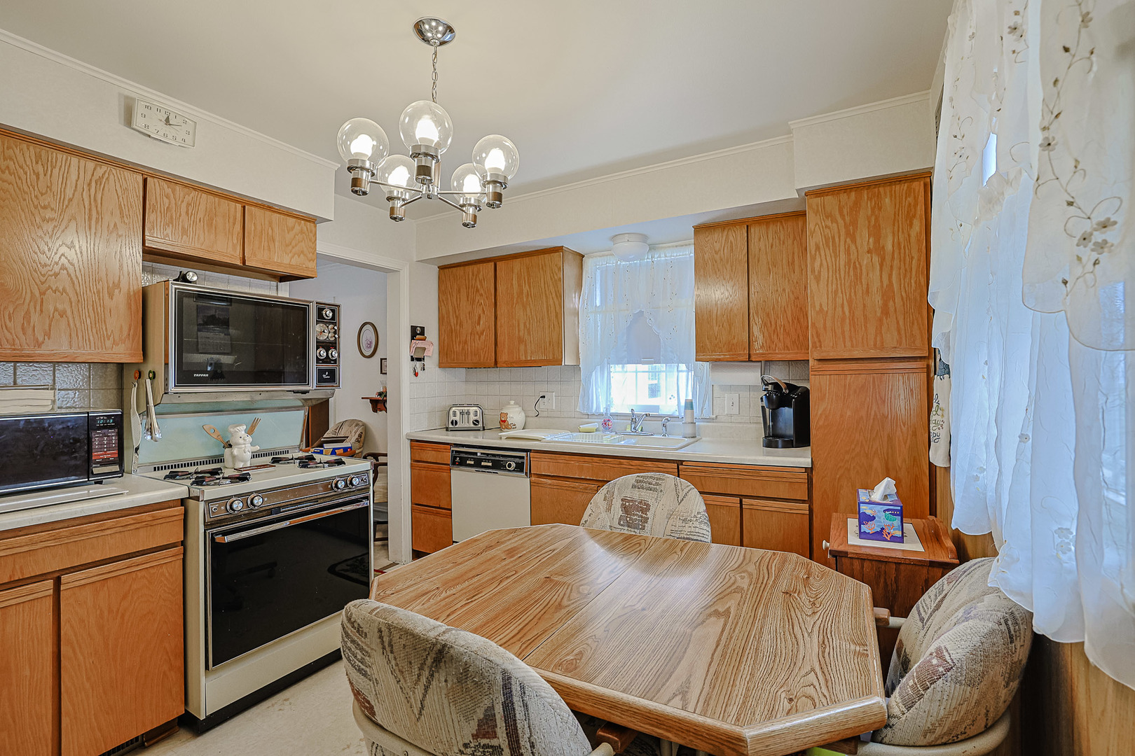 5245 North Rutherford Avenue Chicago, IL 60656 - Photo 9 of 21 a kitchen with a sink appliances and cabinets