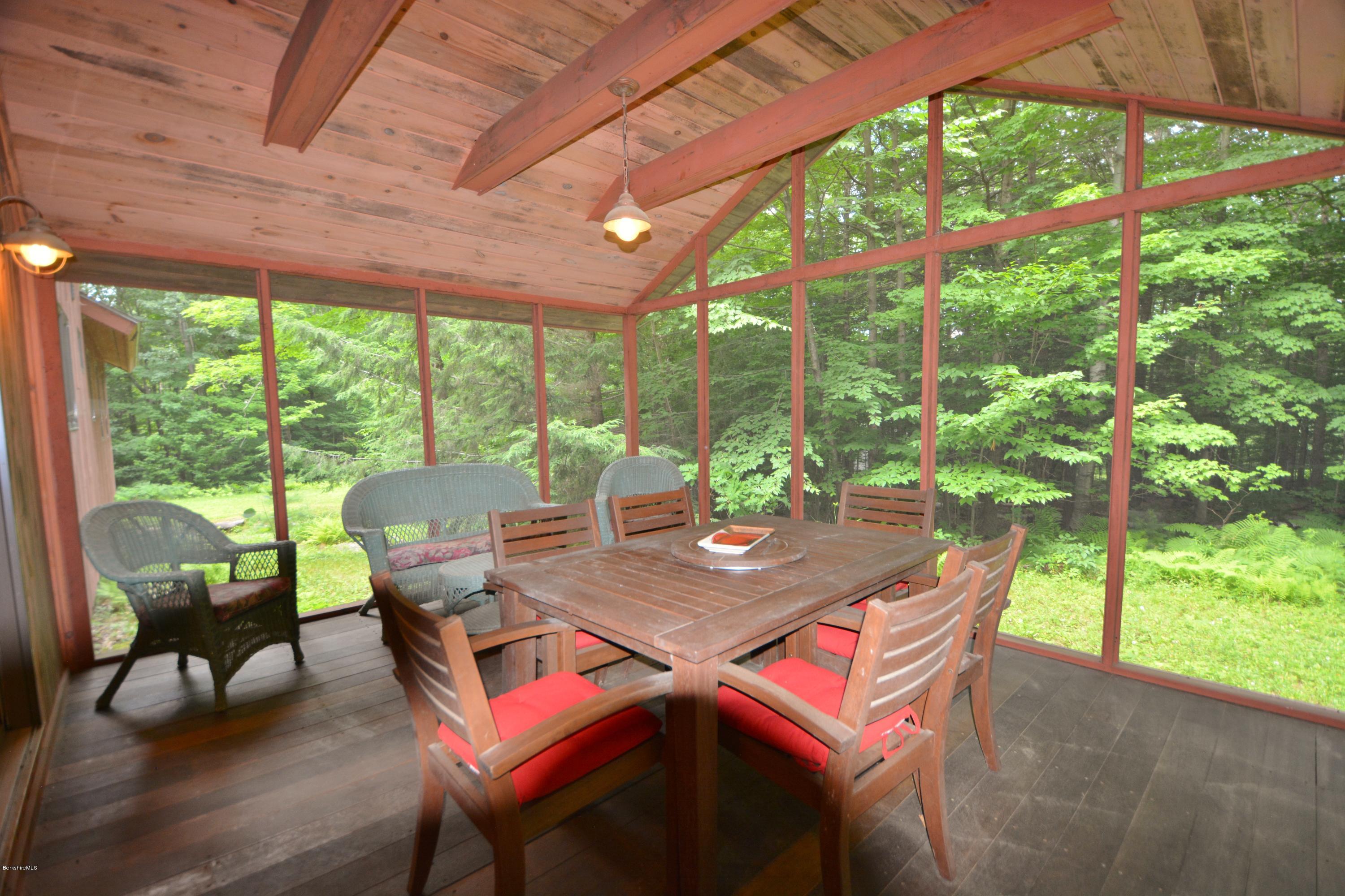 395 Bonny Rigg Hill Road Becket, MA 01223 - Photo 17 of 26 a view of a dining room with furniture window and outside view