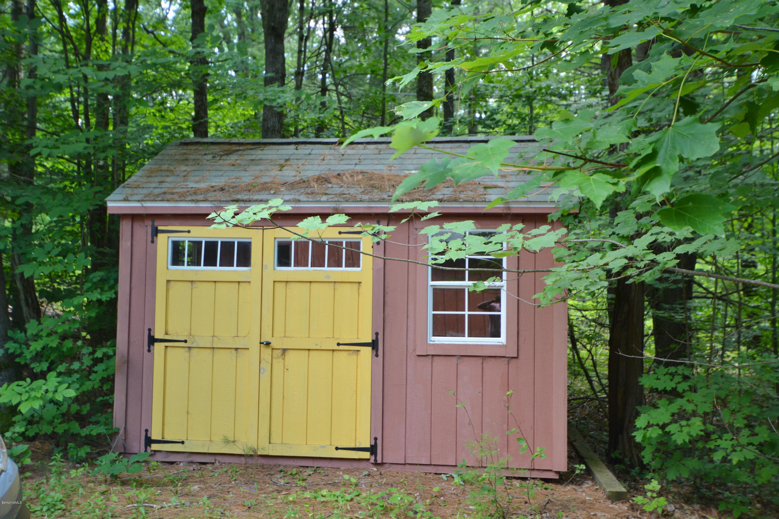 395 Bonny Rigg Hill Road Becket, MA 01223 - Photo 19 of 26 a house view with a garden space