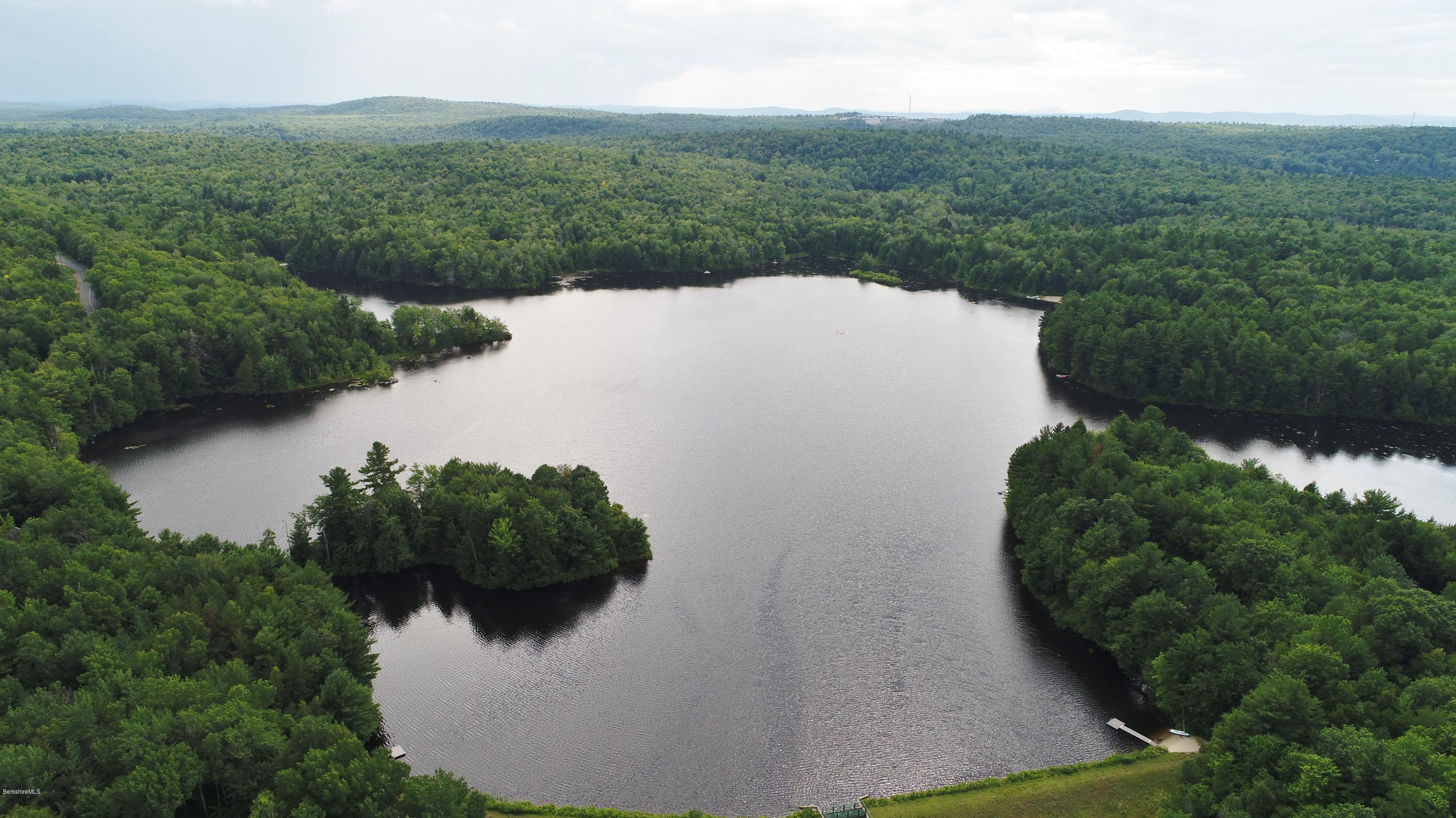 395 Bonny Rigg Hill Road Becket, MA 01223 - Photo 20 of 26 an aerial view of a house with a yard and lake view