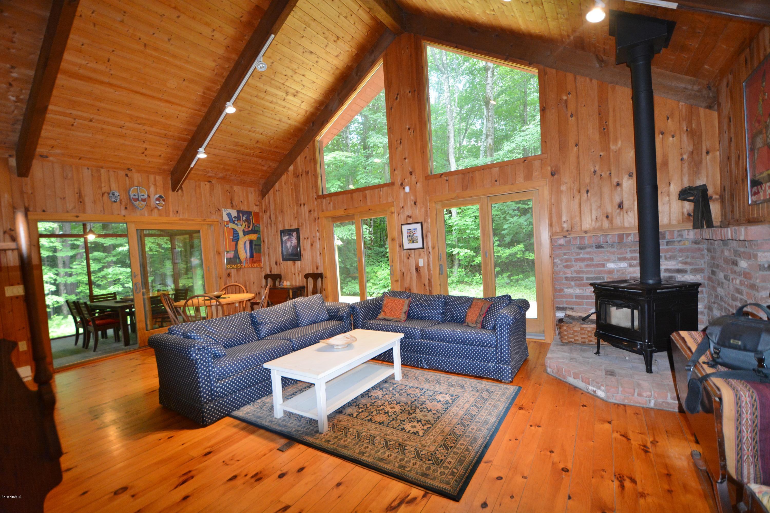 395 Bonny Rigg Hill Road Becket, MA 01223 - Photo 3 of 26 a living room with patio furniture and a large window
