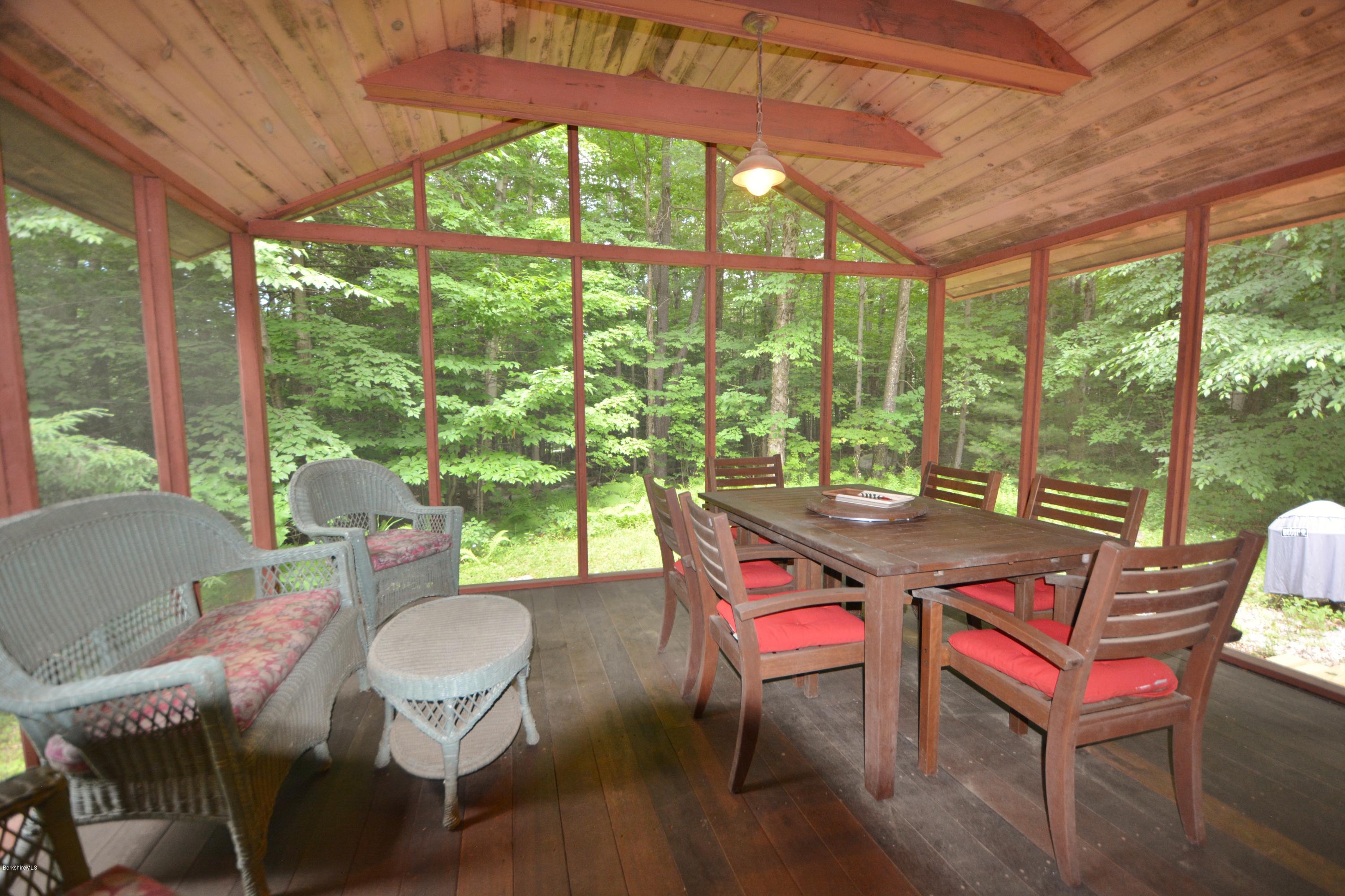 395 Bonny Rigg Hill Road Becket, MA 01223 - Photo 4 of 26 a view of a dining room with furniture window and outside view