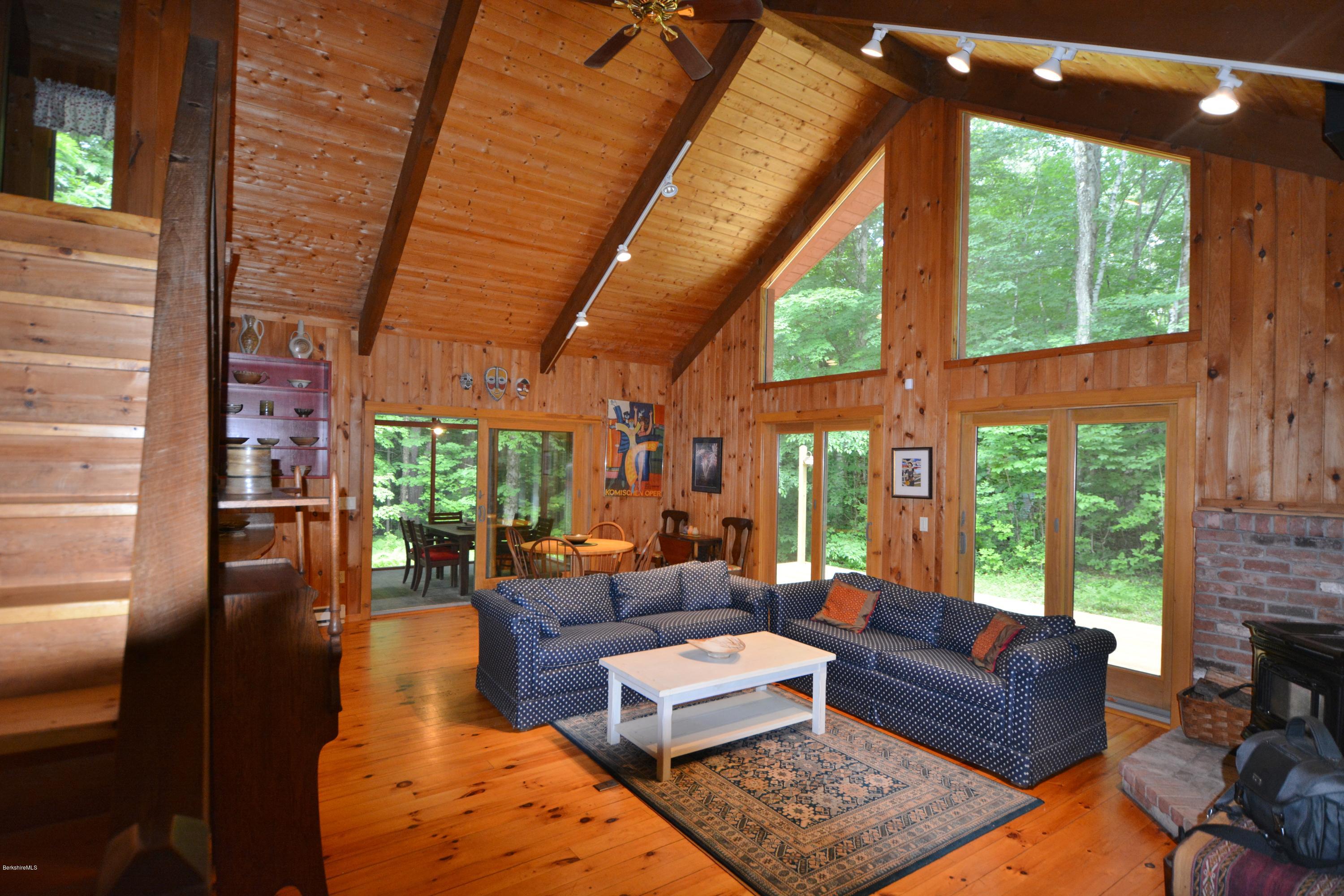 395 Bonny Rigg Hill Road Becket, MA 01223 - Photo 5 of 26 a living room with furniture and a fireplace