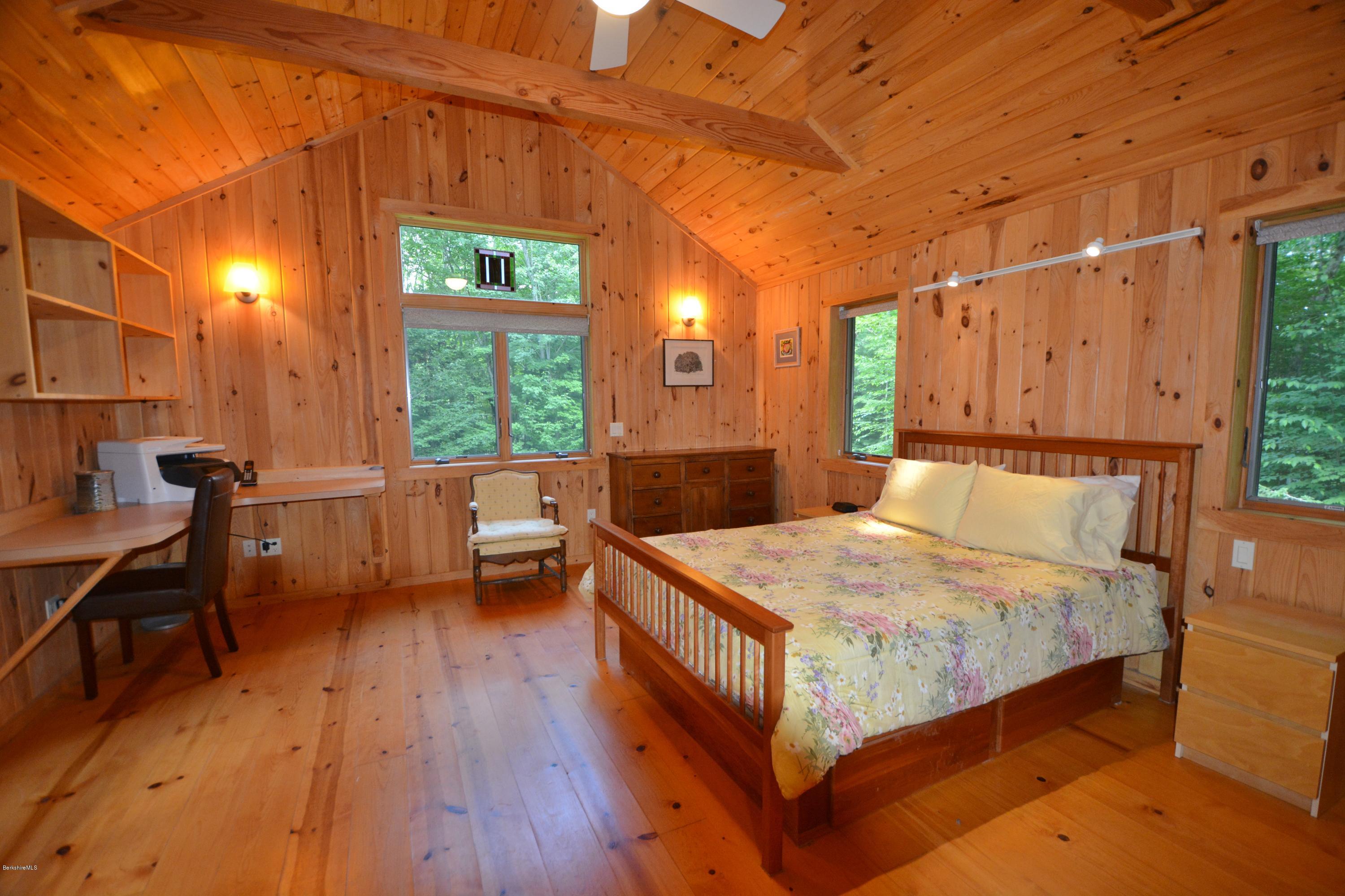 395 Bonny Rigg Hill Road Becket, MA 01223 - Photo 9 of 26 a bedroom with a bed and wooden floor