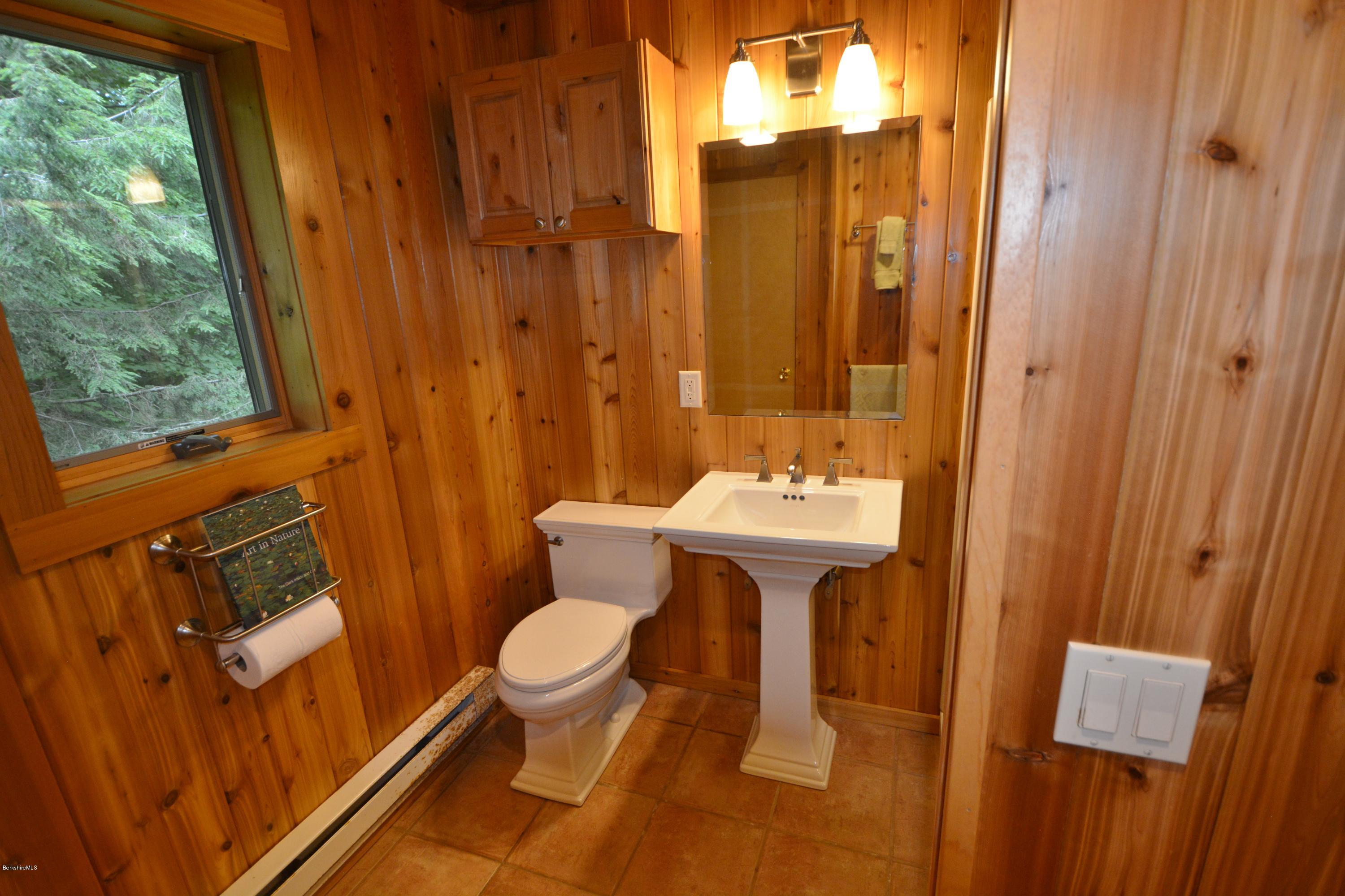395 Bonny Rigg Hill Road Becket, MA 01223 - Photo 10 of 26 a bathroom with a sink toilet and shower