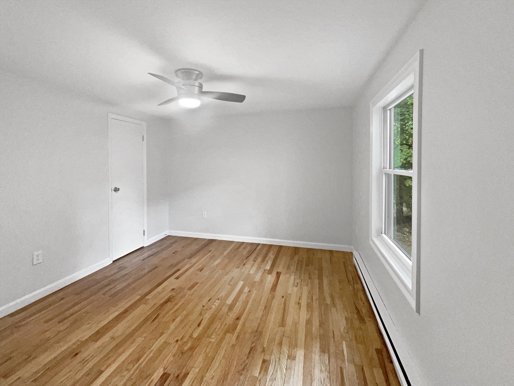 30 Manhattan Road Worcester, MA 01602 - Photo 17 of 27 wooden floor in an empty room with a window