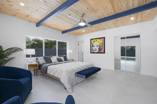 a bed room with a bed and a couch