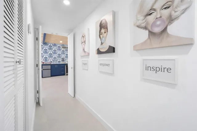 a spacious bedroom with a large bed and a large window