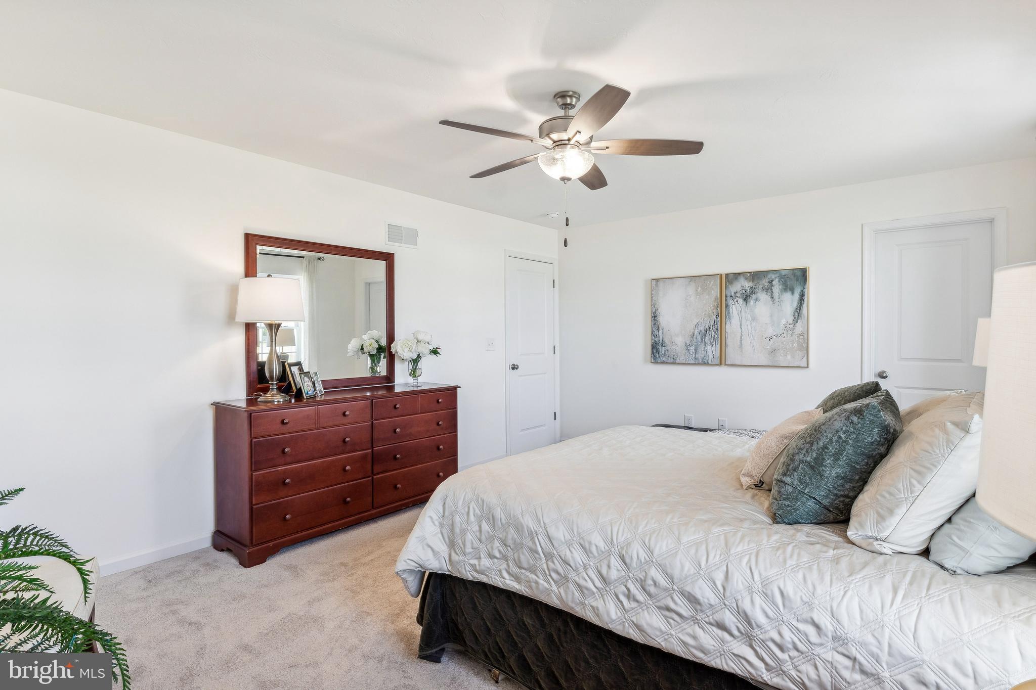 2601 Village Road Dover, PA 17315 - Photo 14 of 20 a bedroom with a bed and a mirror