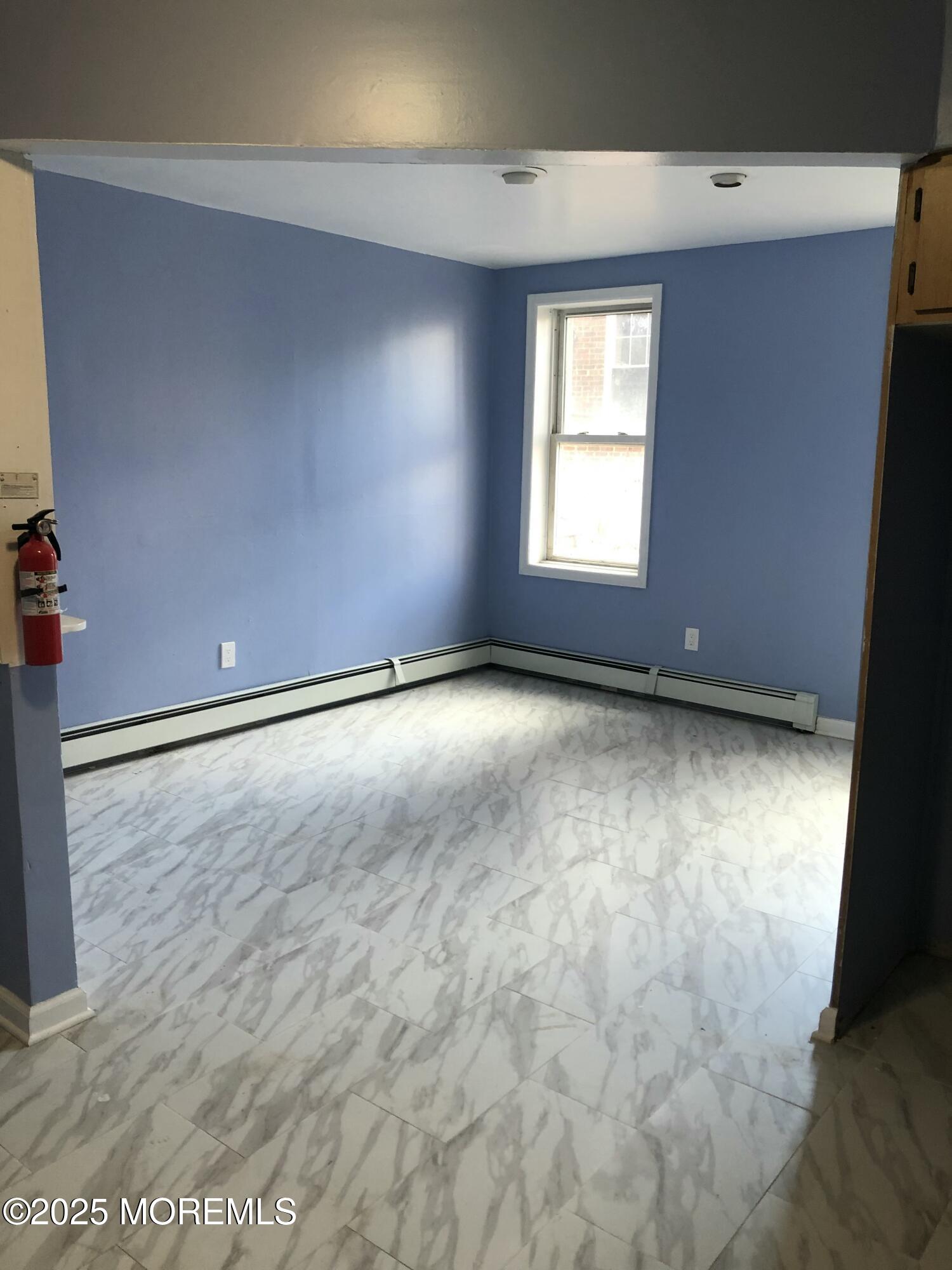 505 5th Street Union City, NJ 07087 - Photo 11 of 16 an empty room with windows