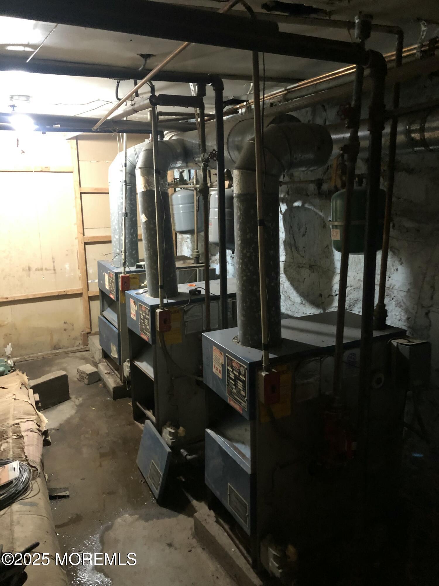 505 5th Street Union City, NJ 07087 - Photo 16 of 16 a room with water heater and a table