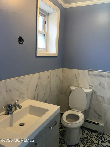 a bathroom with a sink and a toilet