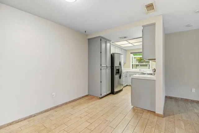 wooden floor in a kitchen and a livingroom
