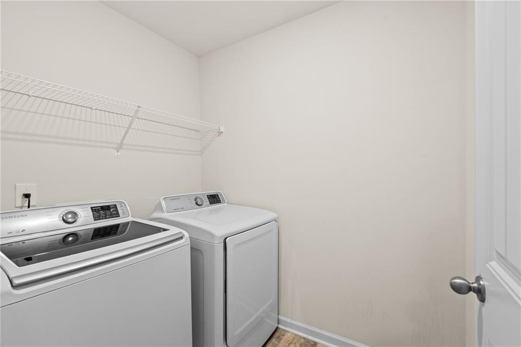 297 Starbuck Parkway Pendergrass, GA 30567 - Photo 12 of 50 a utility room with dryer and washer