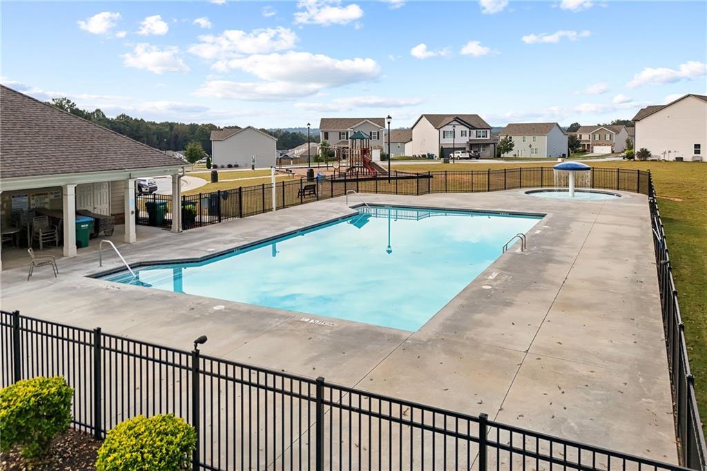 297 Starbuck Parkway Pendergrass, GA 30567 - Photo 15 of 50 a view of a swimming pool with a terrace