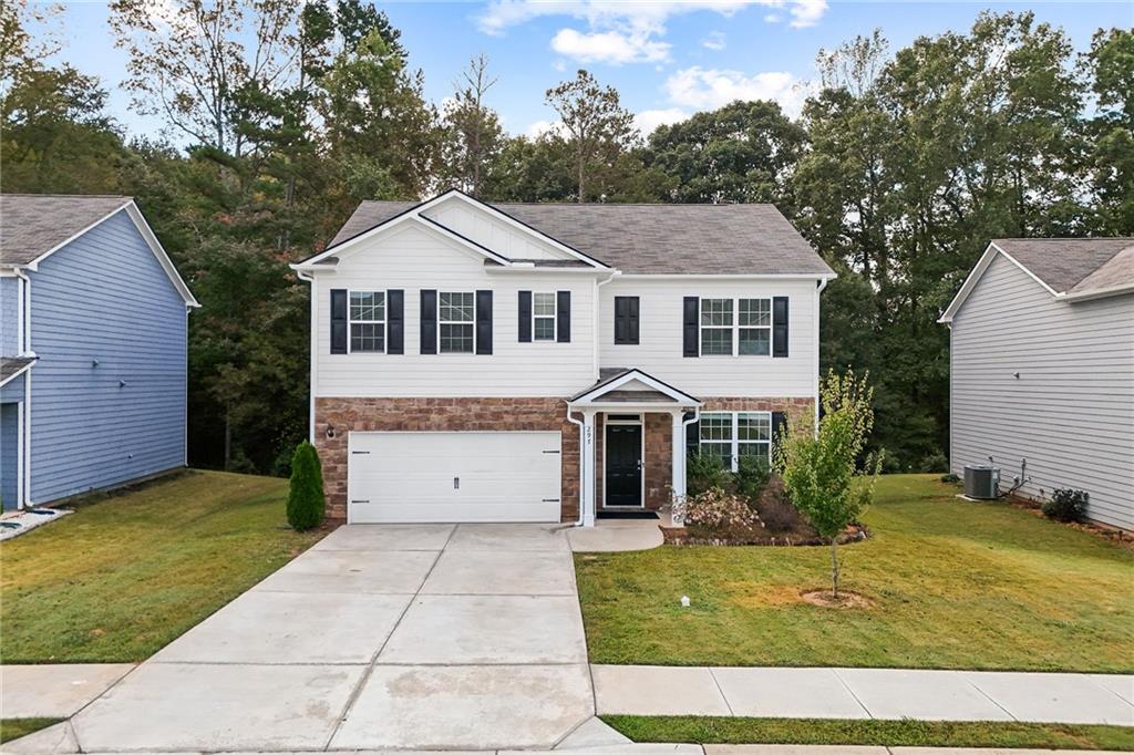 297 Starbuck Parkway Pendergrass, GA 30567 - Photo 17 of 50 a front view of a house with a yard