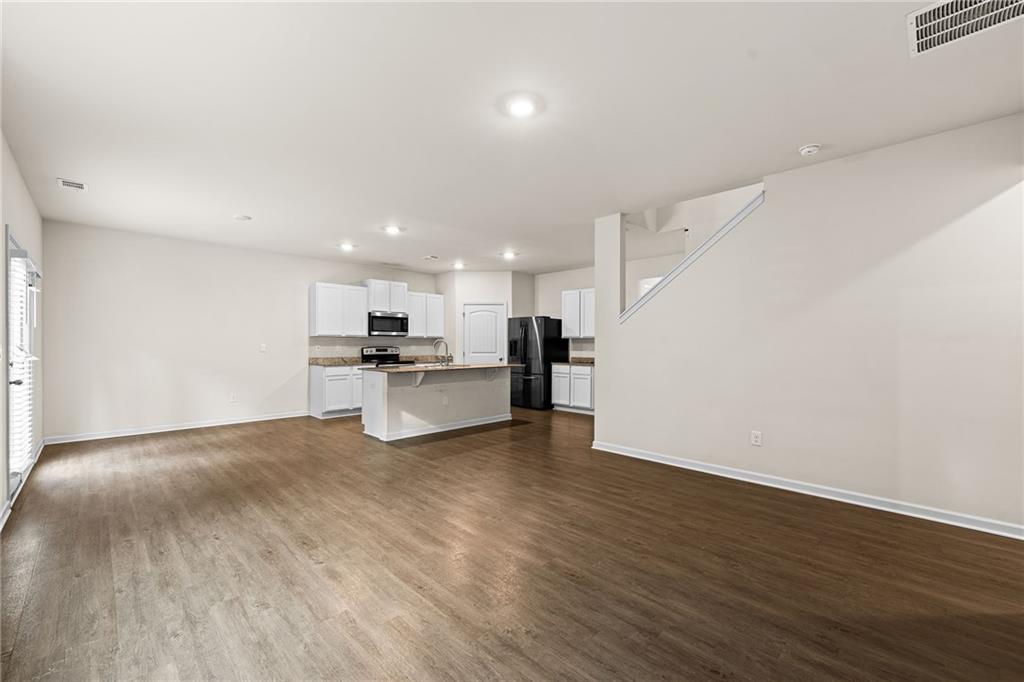 297 Starbuck Parkway Pendergrass, GA 30567 - Photo 28 of 50 a view of kitchen with wooden floor