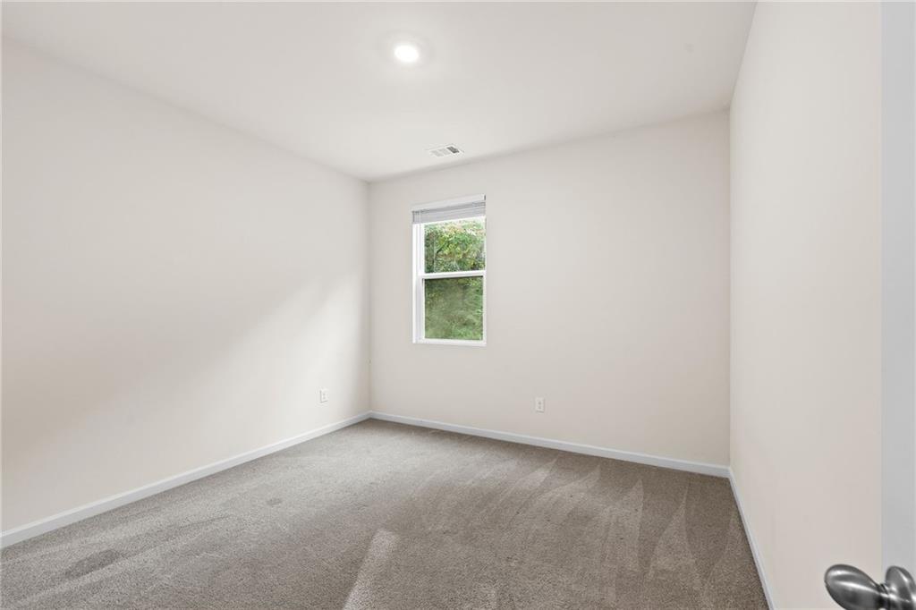 297 Starbuck Parkway Pendergrass, GA 30567 - Photo 29 of 50 an empty room with windows