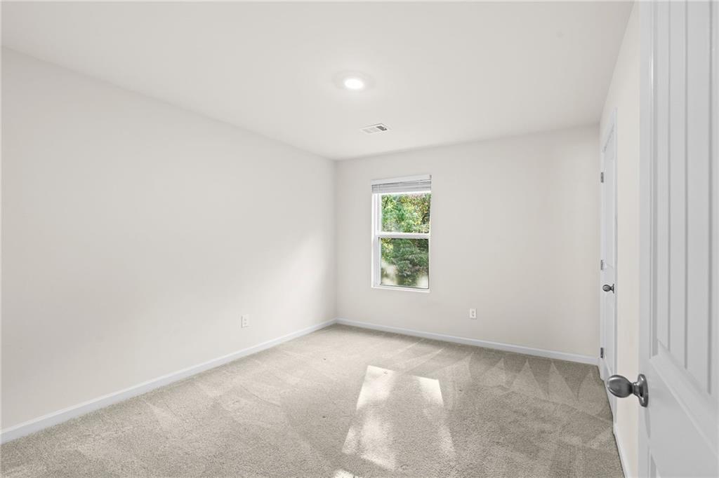 297 Starbuck Parkway Pendergrass, GA 30567 - Photo 36 of 50 an empty room with a window