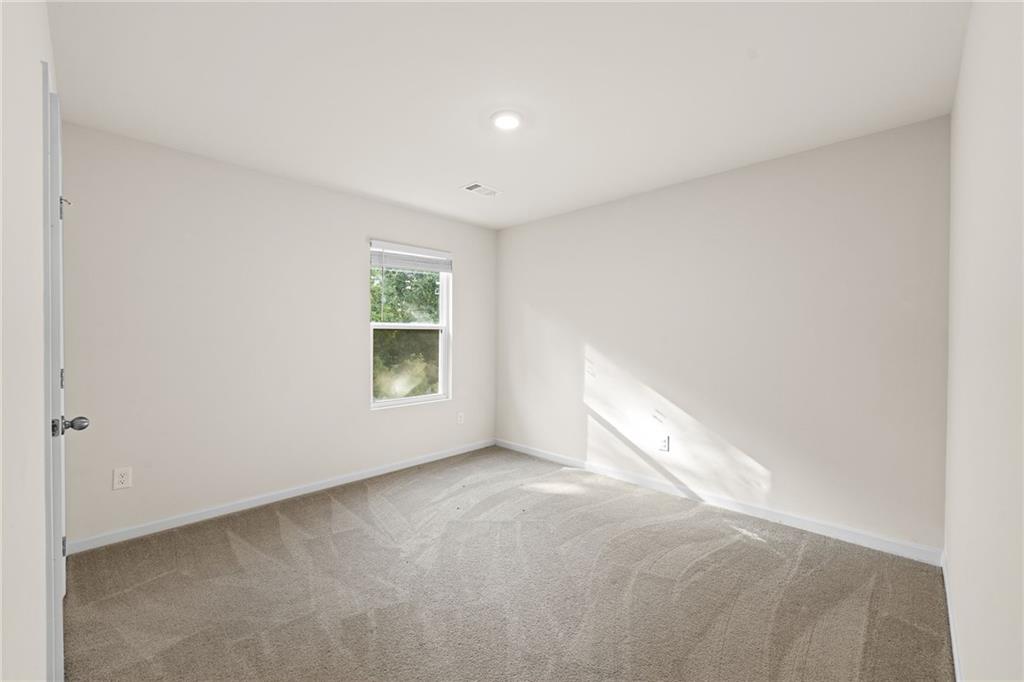 297 Starbuck Parkway Pendergrass, GA 30567 - Photo 39 of 50 a view of an empty room with a window