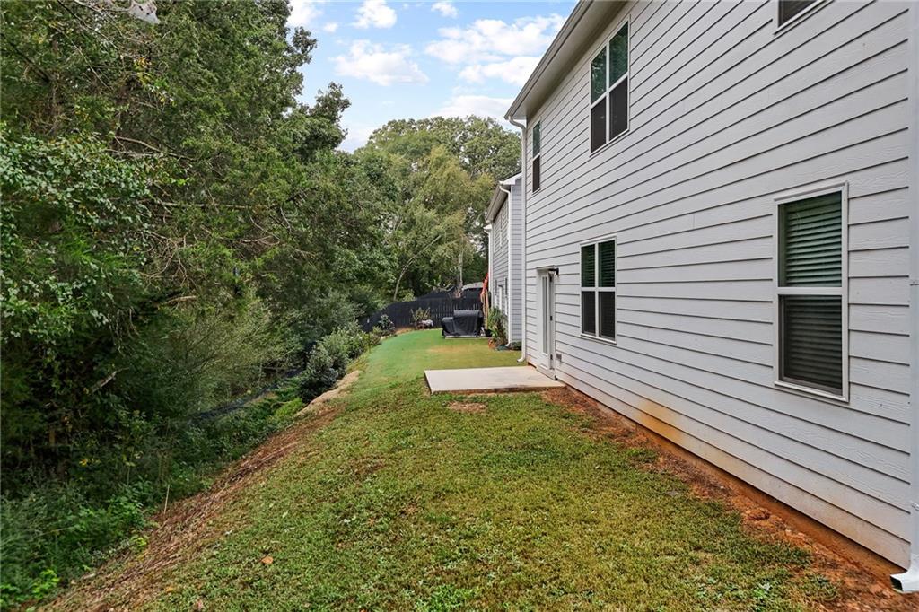 297 Starbuck Parkway Pendergrass, GA 30567 - Photo 43 of 50 a view of a back yard of the house