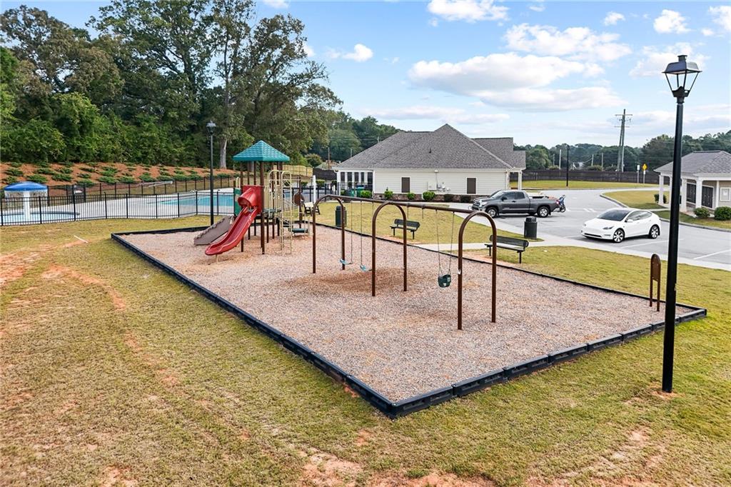 297 Starbuck Parkway Pendergrass, GA 30567 - Photo 48 of 50 a view of a swimming pool with a patio and lake view