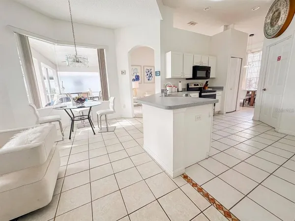 a kitchen with a sink cabinets and stainless steel appliances