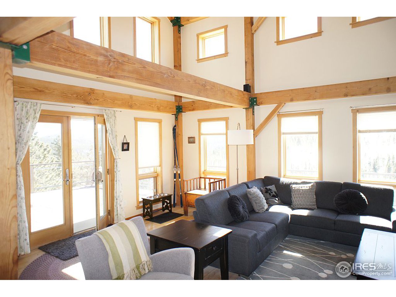 153 North Beaver Road Black Hawk, CO 80422 - Photo 8 of 25 a living room with furniture and large windows