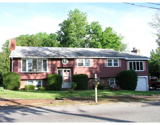 487 River Road Tewksbury, MA 01876 - Photo 1 of 1 front view of a house with a yard