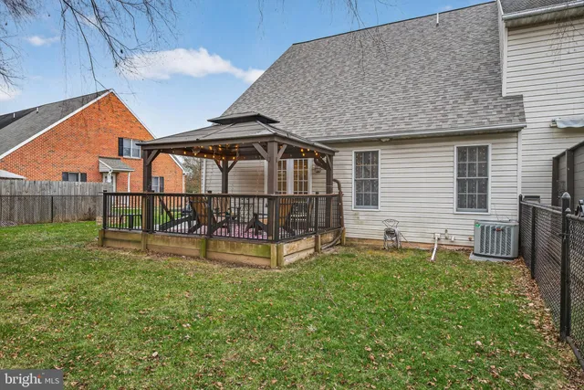 a view of a house with backyard and a slide