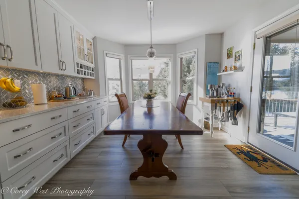 a stove top oven sitting inside of a kitchen