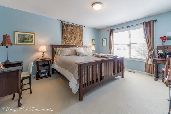 a bathroom with a sink a mirror and a shower