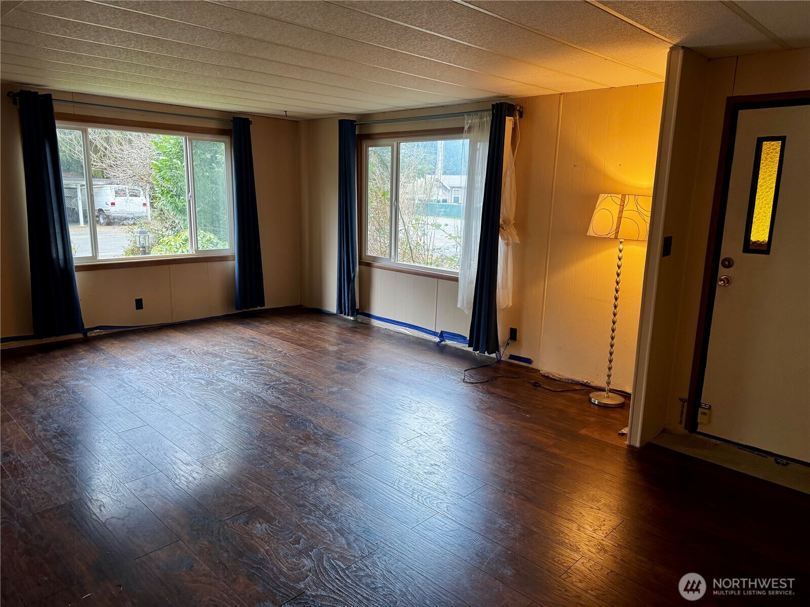 20501 31st Drive Southeast Bothell, WA 98012 - Photo 2 of 11 an empty room with wooden floor and windows