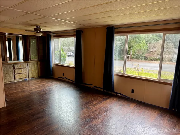 a view of room with window and wooden floor