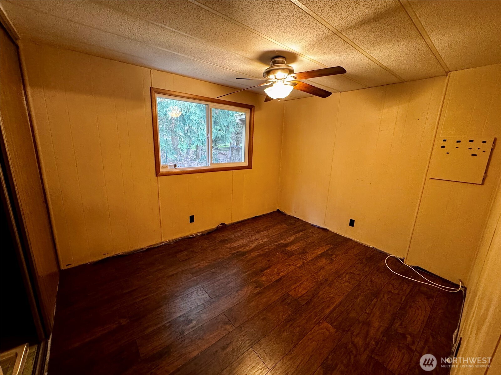 20501 31st Drive Southeast Bothell, WA 98012 - Photo 7 of 11 a view of a room with wooden floor and chandelier