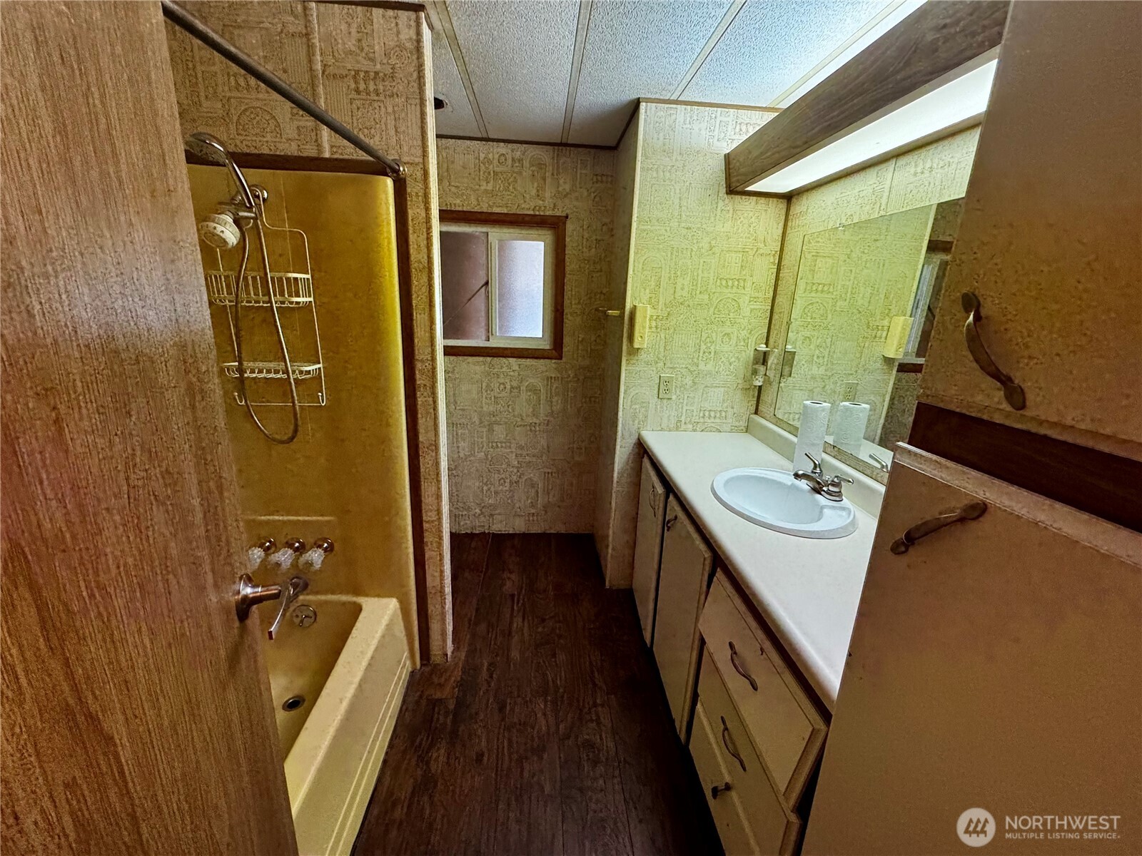20501 31st Drive Southeast Bothell, WA 98012 - Photo 8 of 11 a bathroom with a sink a mirror and a bathtub