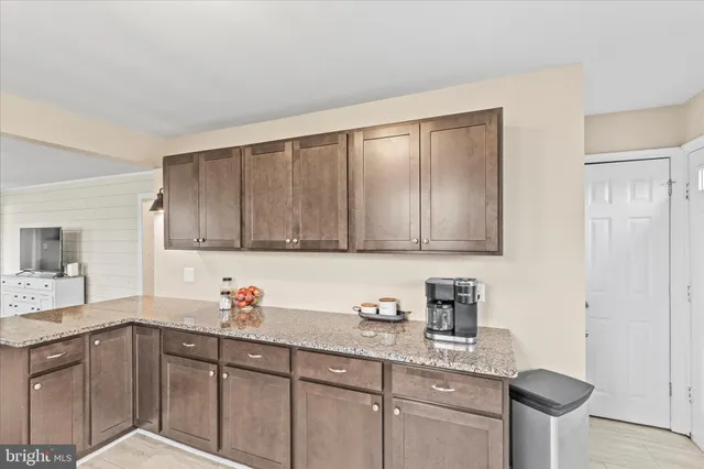 a kitchen with a sink cabinets and window