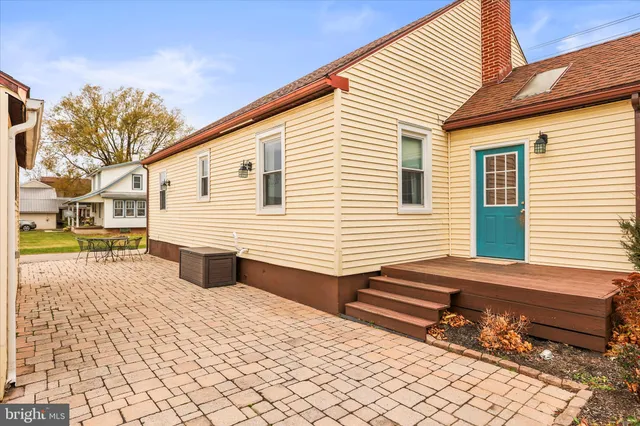 a backyard of a house with wooden fence
