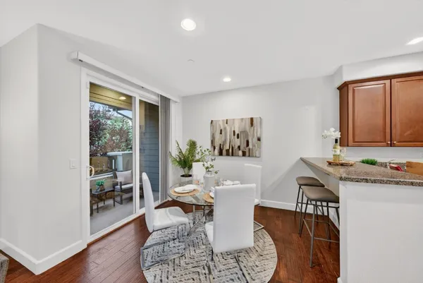 a living room with furniture a window and a table