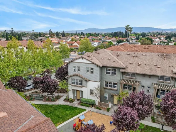 an aerial view of a house with a big yard
